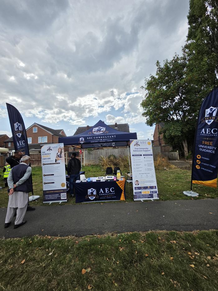 Visitors walking past the AEC Consultant stand at Summer Fest