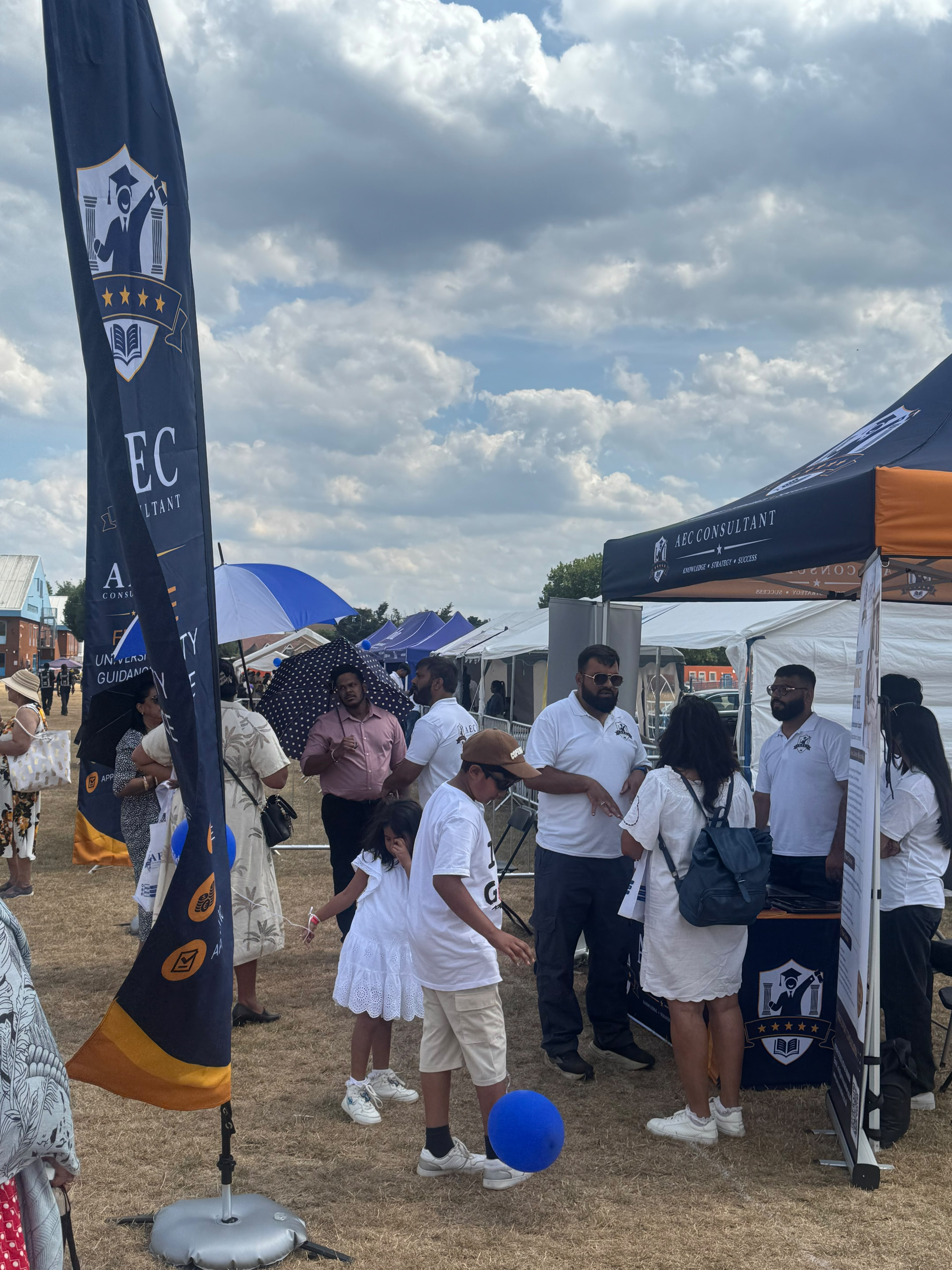 AEC Consultant advisers speaking with families beside the stand at the UK Goan Festival 2026